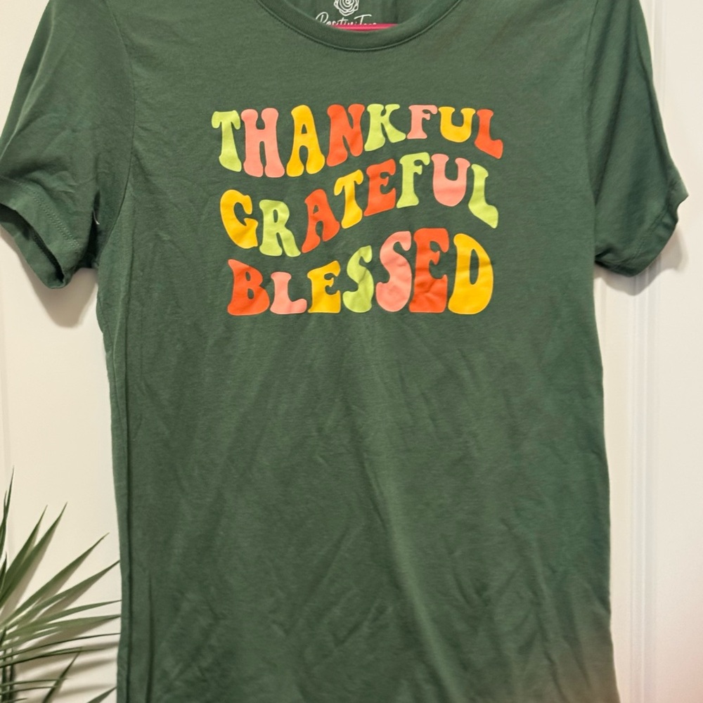Green Graphic Tee with Colorful Text